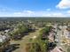 Aerial view of a golf course and residential area at 5493 Legend Hills Ln, Spring Hill, FL 34609