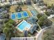 Aerial view of community tennis courts and pool at 5493 Legend Hills Ln, Spring Hill, FL 34609