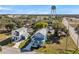 Two new construction homes, one white and one blue, near a water tower at 5742 Meadowlane St, New Port Richey, FL 34652