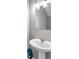 Clean bathroom with pedestal sink and modern vanity lighting at 5742 Meadowlane St, New Port Richey, FL 34652