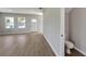 Small powder room with a toilet and gray flooring at 5742 Meadowlane St, New Port Richey, FL 34652
