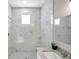 Clean bathroom with marble shower and single vanity at 5742 Meadowlane St, New Port Richey, FL 34652