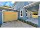 New home features a yellow two-car garage at 5742 Meadowlane St, New Port Richey, FL 34652