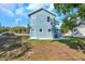 Newly built home with blue siding and a small side yard at 5742 Meadowlane St, New Port Richey, FL 34652