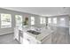 Granite kitchen island with sink and dishwasher at 5742 Meadowlane St, New Port Richey, FL 34652