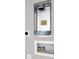 Laundry closet with hookups and built-in shelving at 5742 Meadowlane St, New Port Richey, FL 34652