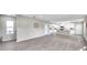 Open floor plan with kitchen and stairs to upper level at 5742 Meadowlane St, New Port Richey, FL 34652