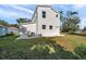 Side view of a two-story house with a small yard at 5746 Meadowlane St, New Port Richey, FL 34652