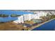 Aerial view of waterfront condos with parking and tennis courts at 5915 Sea Ranch Dr # 704, Hudson, FL 34667