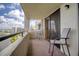 Spacious balcony with water views and seating for two at 5915 Sea Ranch Dr # 704, Hudson, FL 34667