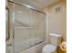 Bathroom with shower, toilet, and tiled floor at 5915 Sea Ranch Dr # 704, Hudson, FL 34667