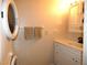 Clean bathroom with vanity, sink and stacked washer/dryer at 5915 Sea Ranch Dr # 704, Hudson, FL 34667