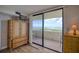 Bedroom with hardwood floors, balcony access and built-in storage at 5915 Sea Ranch Dr # 704, Hudson, FL 34667
