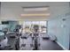 Fitness center with cardio equipment and water views at 5915 Sea Ranch Dr # 704, Hudson, FL 34667