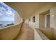 Building hallway with tiled floors and ocean view at 5915 Sea Ranch Dr # 704, Hudson, FL 34667