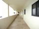 Building hallway with tiled floors and ocean view at 5915 Sea Ranch Dr # 704, Hudson, FL 34667