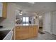 Condo kitchen with light wood cabinets and white appliances at 5915 Sea Ranch Dr # 704, Hudson, FL 34667