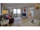 Bright living room with water view, hardwood floors, and comfortable seating at 5915 Sea Ranch Dr # 704, Hudson, FL 34667