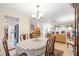 Bright dining room with a table and view of living room at 6453 Wedgewood Dr, Spring Hill, FL 34606