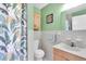 Bathroom with shower and leafy curtain at 6650 Hickorywood Ln # 6650, New Port Richey, FL 34653