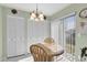 Bright breakfast nook with glass table at 6650 Hickorywood Ln # 6650, New Port Richey, FL 34653