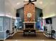 Community room features a large brick fireplace and comfortable seating at 6650 Hickorywood Ln # 6650, New Port Richey, FL 34653