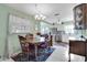 Dining area with table and kitchen view at 6650 Hickorywood Ln # 6650, New Port Richey, FL 34653
