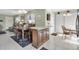 Dining area with wood table and chairs, adjacent to the kitchen at 6650 Hickorywood Ln # 6650, New Port Richey, FL 34653