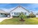 Charming light green single-story home with a well-manicured lawn at 6650 Hickorywood Ln # 6650, New Port Richey, FL 34653
