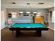 Community game room with billiard table and wall decor at 6650 Hickorywood Ln # 6650, New Port Richey, FL 34653