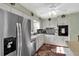 White kitchen with stainless steel appliances and a breakfast bar at 6650 Hickorywood Ln # 6650, New Port Richey, FL 34653