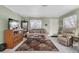 Living room with beige couch, recliner, and wood coffee table at 6650 Hickorywood Ln # 6650, New Port Richey, FL 34653