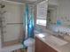 Updated bathroom with walk-in shower and wood vanity at 7129 Beachdale Ct, Port Richey, FL 34668