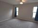 Bedroom with neutral walls, carpet, and ceiling fan at 7129 Beachdale Ct, Port Richey, FL 34668