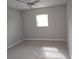 Spacious bedroom with ceiling fan and neutral carpeting at 7129 Beachdale Ct, Port Richey, FL 34668