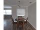 Dining area with wood table and chairs, and neutral decor at 7129 Beachdale Ct, Port Richey, FL 34668
