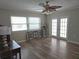 Bright Gathering room with hardwood floors and french doors at 7129 Beachdale Ct, Port Richey, FL 34668
