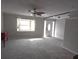 Spacious living room featuring neutral walls and carpet at 7129 Beachdale Ct, Port Richey, FL 34668