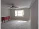 Living room with bay window and ceiling fan at 7129 Beachdale Ct, Port Richey, FL 34668