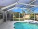 Screened pool and patio area with backyard view at 7129 Beachdale Ct, Port Richey, FL 34668