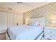 Spacious bedroom with a queen bed and ample closet space at 7290 Rosemont Ln, Spring Hill, FL 34606