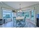 Cozy breakfast nook with a round table and teal chairs at 7290 Rosemont Ln, Spring Hill, FL 34606