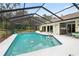 Relaxing screened pool and patio area, offering privacy and outdoor enjoyment at 7368 Royal Oak Dr, Spring Hill, FL 34607