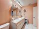 Double sink bathroom with a large vanity and mirror at 8015 Pequena Dr, Port Richey, FL 34668