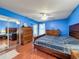 Large bedroom with ample closet space and wood flooring at 8015 Pequena Dr, Port Richey, FL 34668