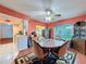 Dining room features a round table, four chairs and view to backyard at 8015 Pequena Dr, Port Richey, FL 34668