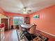 Cozy dining area with hardwood floors and a round table at 8015 Pequena Dr, Port Richey, FL 34668