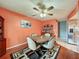 Bright dining room with table and chairs, ceiling fan, and access to kitchen at 8015 Pequena Dr, Port Richey, FL 34668
