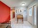 The entryway features a wooden secretary desk and red painted walls at 8015 Pequena Dr, Port Richey, FL 34668