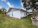 Side view of the house showcasing additional landscaping and windows at 8015 Pequena Dr, Port Richey, FL 34668